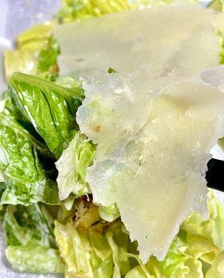 Caesar salad - romaine, homemade herbed croutons, tossed with Caesar dressing and topped with Parmigiano Reggiano