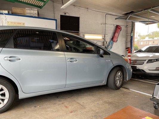 Toyota Prius getting smog check.