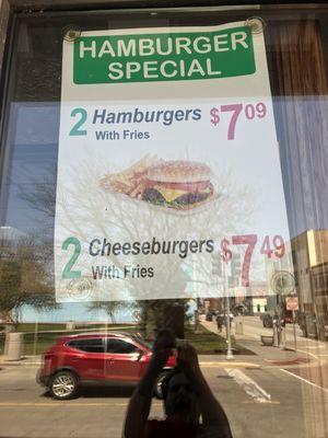 Sign in the window. I went with the 2 Hamburger and fry special for$7.09. They have lots of specials and choices.