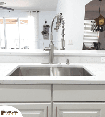 White quartz countertop with a Zero Radius Undermount Sink installed by the Sanford Granite Team in Sanford.