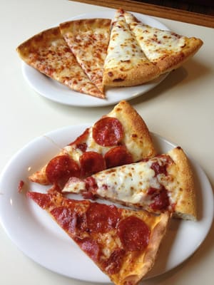 Pizza from the buffet!  A spread of cheese and pepperoni of varying widths.  Piece of meat in there too.