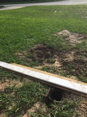 Mess Left. Boards were used to cover the steam of water from the punctured water main.