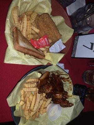 Chicken wings w/fries,fried catfish!! Omg, service was Excellent!!! I would come back for the service and food. Hold up! live band,