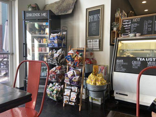 Chips and drinks, pastry case, coffee menu