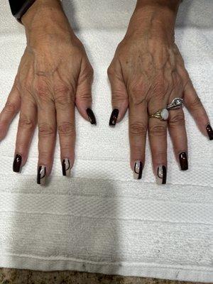 My nail tech designed my nails from a fall 2024 design.,,I  them and have already gotten so many compliments! Sarah, thank you!