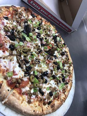 Supreme--pepperoni, hamburger, pork sausage, ham, mushrooms, onions, bell peppers, black olives and green olives.