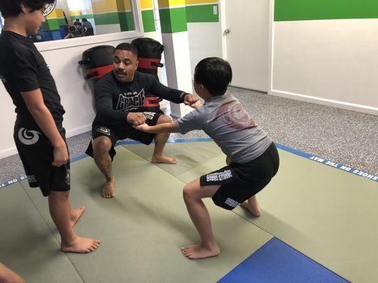 Cristiano hands on with the kids getting in their strength training.