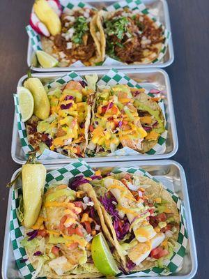 Bottom to top: Baja fish tacos, Salmon tacos, and Birria tacos