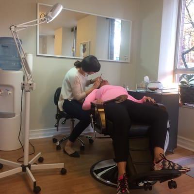 My mother getting her brows done!