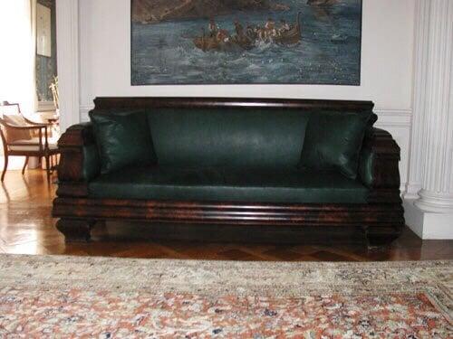 Antique sofa in green leather