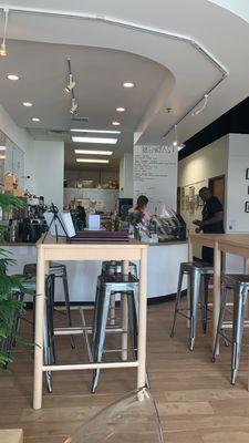 View of seating and a side view of the front counter