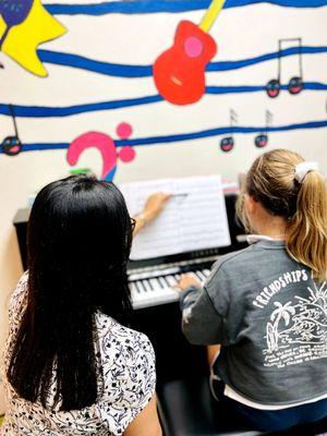 Piano lesson in progress