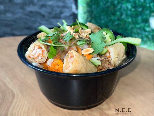 Vermicelli Bowl with Egg Rolls, Garlic Shrimp, Grilled Pork, and Roasted Pork Belly