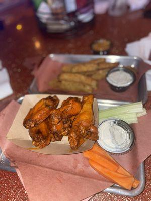 Smoked buffalo wings and fried pickle spears