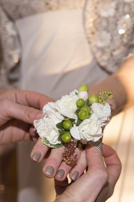 The mothers' corsages. Looks like carnations