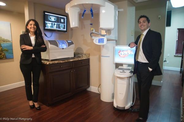 Dr. Parra and Dr. Craighead with the SIRONA XG3D CBCT Machine and CEREC OMNI Cam Digital impression and crown milling units