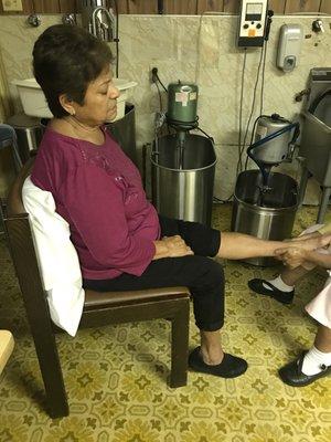 My mom getting massaged after having her foot in the whirlpool for 20 mins.