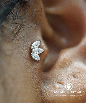 Tragus piercing with an 18k White Gold Marquise Fan.