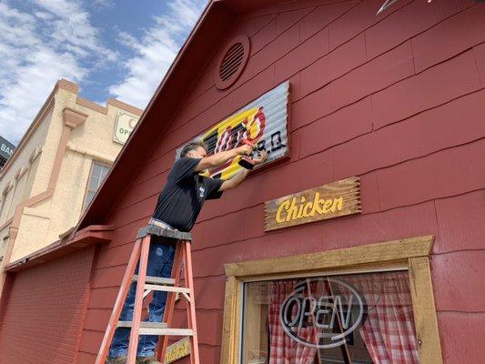 Orlando setting up our sign at our location in Eagle Pass.