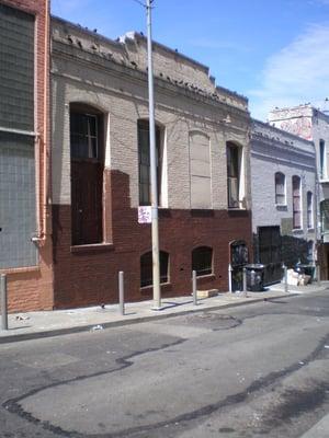 The back of the Masjid- Women's Entrance near the Garbage Cans