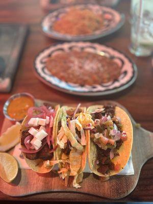 Tacos de asada, pollo and adobada. Rice n beans .