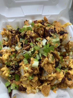 Loaded Fries (crispy chicken, beef bacon, scallions, fries, mild sauce homemade and cheese sauce.