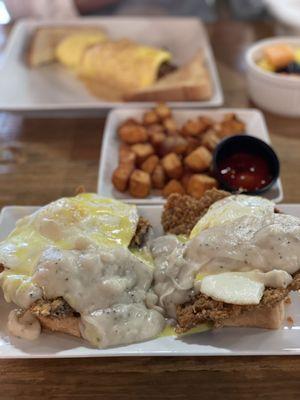 Crazy Cowboy, Texas toast stacked with chicken fried steak, gravy and over easy eggs, topped with hollandaise sauce. So good!