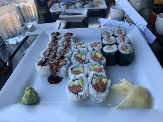 Maki Combo, shrimp tempura roll on left, Alaska roll in the center and yellowtail roll on the right.