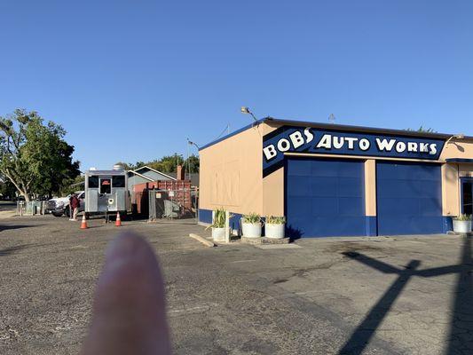 See the truck hidden behind Bob's Auto Works