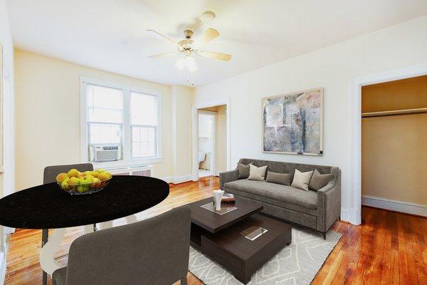 1818 Riggs Place Studio Apartments living area with day bed. Located in DuPont Circle DC