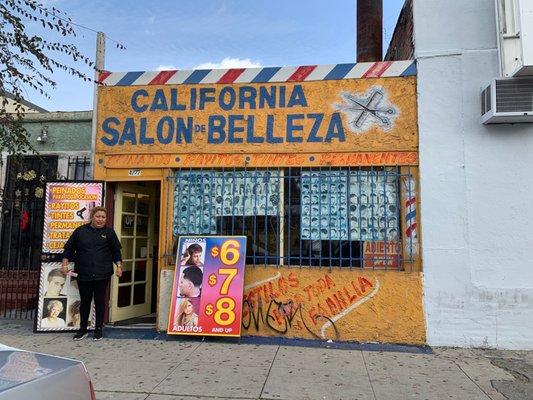 Front of store and that's the lady that cut my hair lol