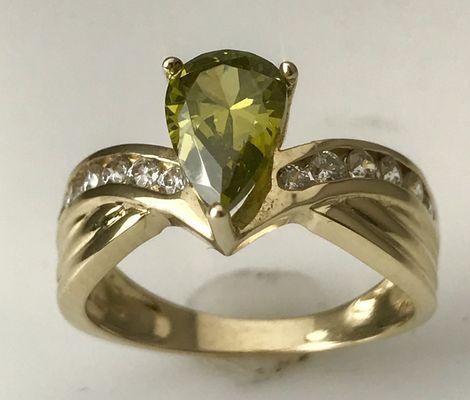 Peridot and gold ring