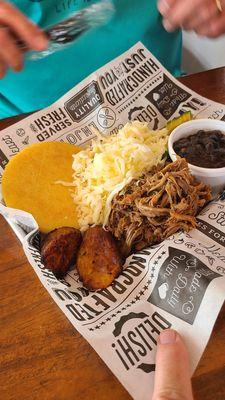 (I can't remember the name of this dish) shredded beef, cheese, black beans,  avocado,  and plantains. Delish!!