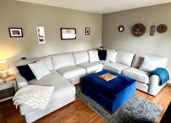 The sectional fit in nicely with our existing ottoman and ugly shag rug. If only it always looks like this, only for a photo op.