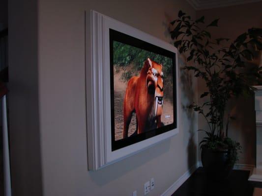 Custom framed flat panel TV.