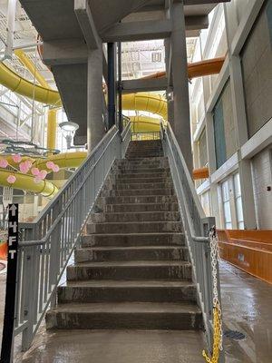 These stairs lead to 2 slides. Must be 4' tall. One slide requires a mat. (5/6/2023)