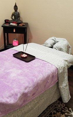 Inside treatnent studio 116. Massage table is ready, clean and crisp sheets.