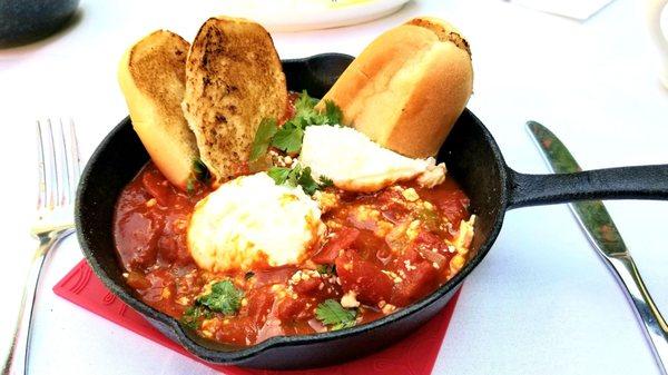 Shakahuka with poached eggs