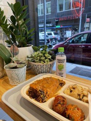 Salmon over rice berry with massaman sauce, curry cakes and mushroom salad