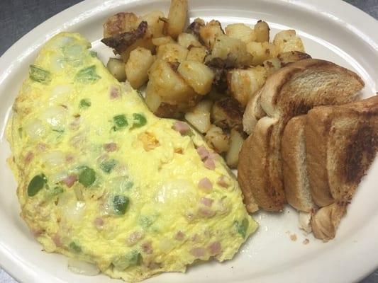 Western omelette served with home fries and toast