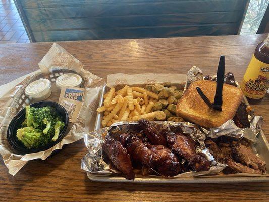 Three meats entree. Chicken Wings, brisket, St. Louis ribs, crinkled fries, fried okra and broccoli  Pick Any Three Items