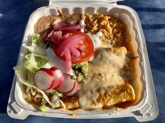 Enchiladas with beans, rice, and salad.