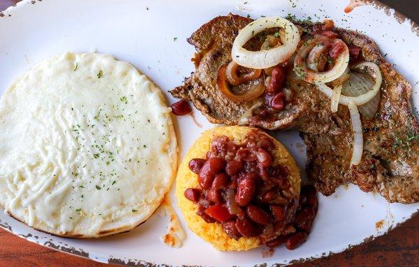 Grilled steak with arepa with an extra side of rice and beans