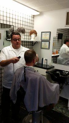 Len giving a haircut to a long time client.