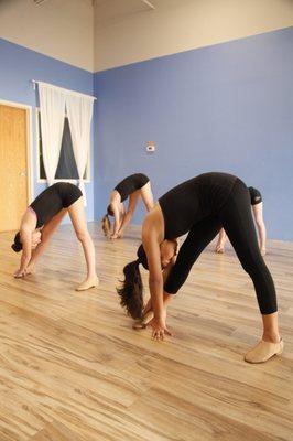 It's important to warm up and stretch before every dance class at Mile High Dance Center!