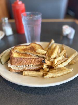 Bacon and Swiss Sandwich and fries.