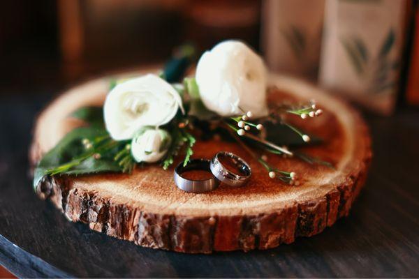 Our wedding bands with the boutonnieres they made for us!