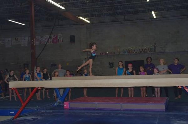 Girls team member on beam