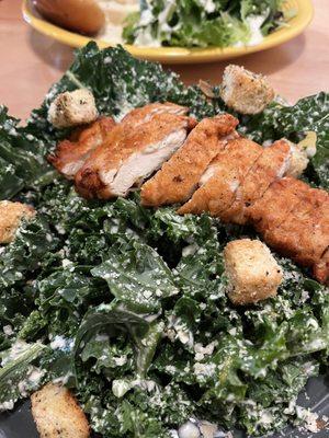 Kale Caesar salad with crispy chicken.