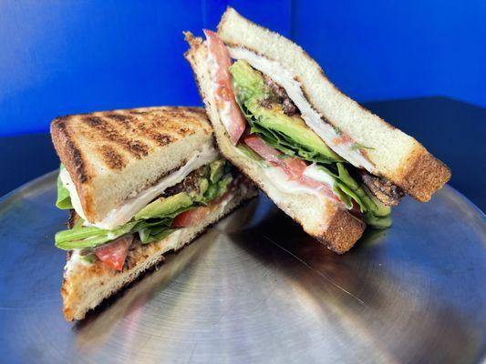 TURKEY AVOCADO BLT

Sliced Turkey, Candied Bacon, Crisp Mixed Greens, Tomatoes, Fresh Avocado, Mayo, Salt, and Pepper on Artisan Bread.